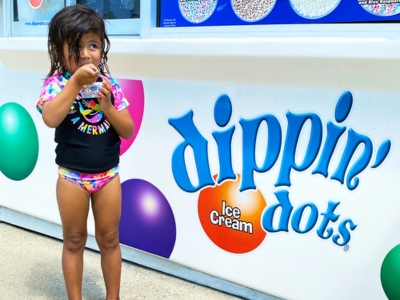 Little Girl eating  - Dippin' Dots at Wet n WIld 
