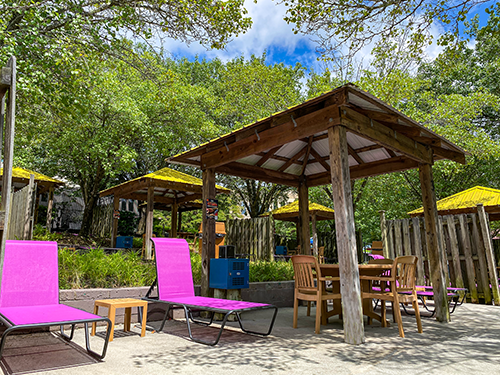 Pink chairs and a table Cabana at Wet n Wild